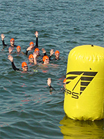 swimmers at the starting buoy